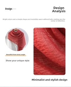 Detail of red cotton linen scarf showing pleated texture and fringe edges on white backdrop