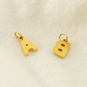 Polished gold stainless steel A and B initial pendants with sparkling rhinestone inlay