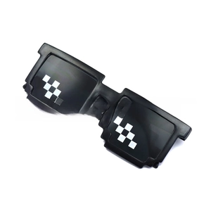 Macro shot of black pixel sunglasses with white square matrix patterns on lenses