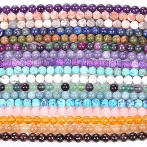 Polished natural gemstone beads collection featuring amethyst, quartz and turquoise spheres
