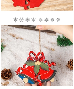 Close-up of a rustic wooden Christmas bell ornament with holly leaves and jute rope
