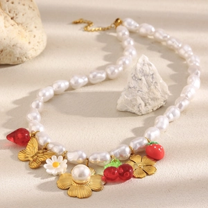 Baroque faux pearl necklace with 18K gold plated charms like flowers and strawberries