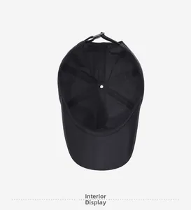 Interior view of black quick-dry baseball cap showing sweatband and adjustable buckle