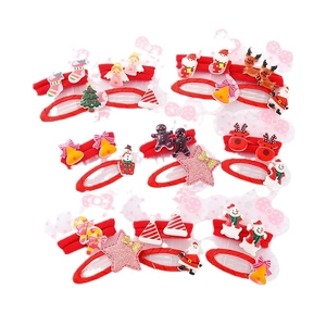 Kids Christmas hair clip set with Santa, snowman, elk, and bells on a white background