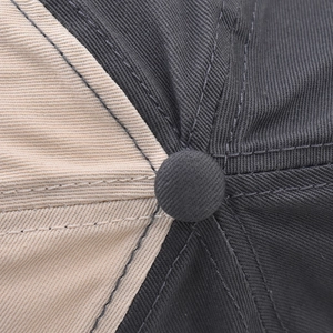 Close-up of contrast color stitching and fabric texture on the washed cotton baseball cap