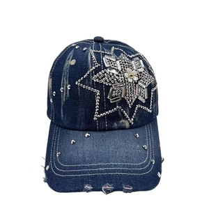 Navy blue washed denim baseball cap with rhinestone star and white flower detail