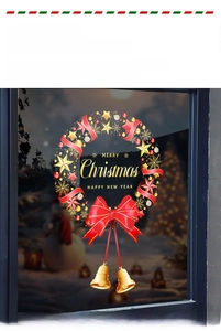 Detailed Christmas wreath window cling with red bow, gold bells and Merry Christmas text