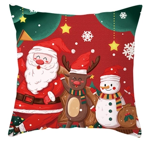 Close-up of Santa Claus reindeer and snowman patterns on festive red Christmas pillowcase