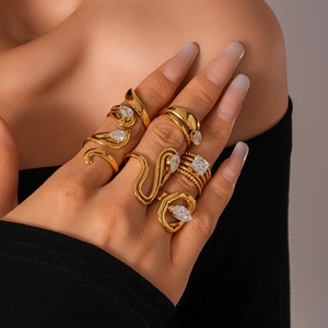 Detailed view of gold plated stackable rings set with sparkling cubic zirconia on hand