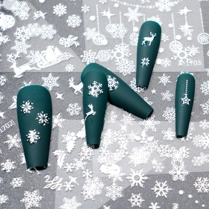 Green matte press-on nails with white snowflake and reindeer Christmas art patterns