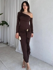 Detail of waist draping with gold metal buckle on dark brown asymmetric dress