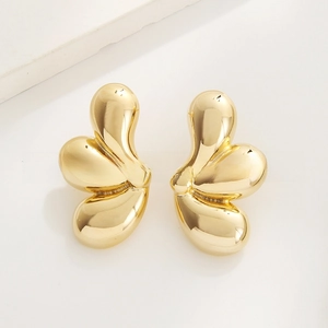 Close-up of gold-plated geometric water drop earrings with a polished mirror finish
