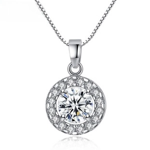 Macro shot of silver halo pendant featuring a central cubic zirconia and box chain