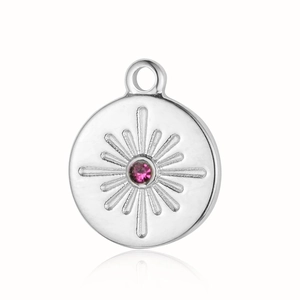Detail of silver sunburst pendant with center pink stone and polished stainless steel finish