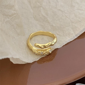 Detail of 925 sterling silver ring with hammer texture and sparkling zircon stones