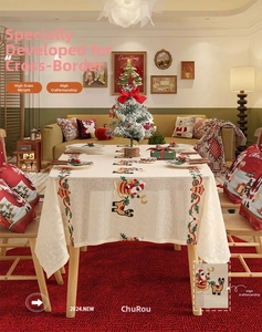 Close-up of festive Santa and reindeer embroidery on premium cream woven tablecloth