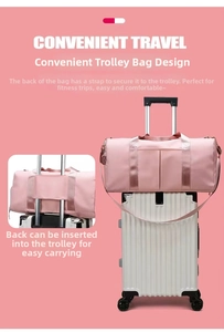 Pink fitness travel bag featuring a convenient luggage sleeve for easy trolley attachment