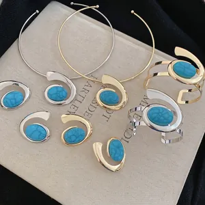 Vintage gold and silver turquoise jewelry set with spiral necklaces, earrings and bracelets