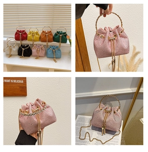 Mini bucket bag with sparkling rhinestones, metal ring handle, and fringe tassels detail