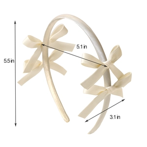 Detailed dimensions of the white satin bow headband showing height and width specs