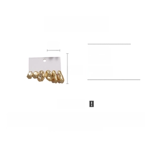 Detailed view of irregular geometric gold earrings set with size and material specs