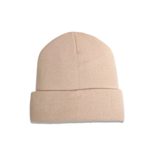 Detailed view of the fine ribbed knit texture and wide folded cuff on this beige beanie