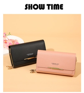 Detail of elegant leather long wallets with gold metal trim and zipper compartments