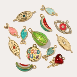 Assorted gold-plated titanium steel charms featuring fish, watermelon, and evil eye designs