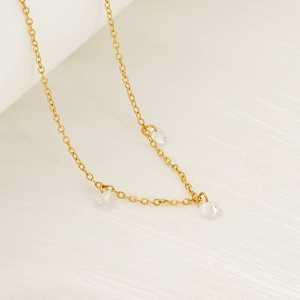 Elegant gold necklace with three zircon pendants on a delicate chain for women