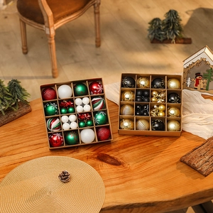 Christmas ball ornament set with red, green and white festive colors on wooden desk