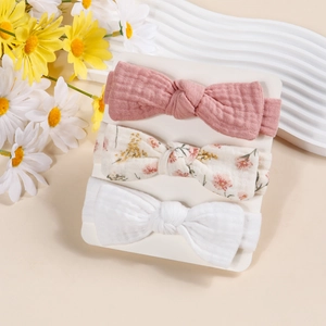 Three-piece infant bow headbands in cotton crepe, featuring floral and solid neutral tones