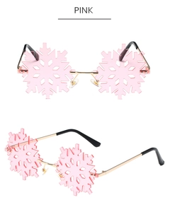 Detail view of pink snowflake-shaped rimless sunglasses with metal frame for parties
