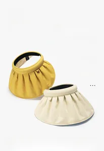 UPF 50+ sun visors in yellow and beige showing UV protection and large brim detail