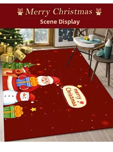 Detailed view of a red Christmas doormat with Santa and reindeer on wooden floor