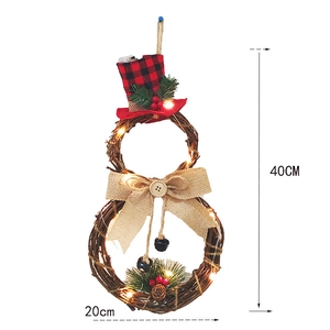 Detail of 40cm snowman rattan Christmas wreath with warm LED lights and pine cone decor
