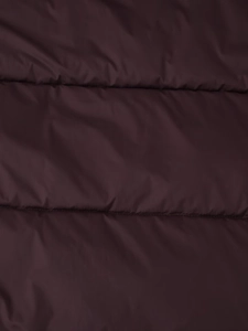 Detailed macro view showing the windproof texture and quilting of the dark purple puffer coat