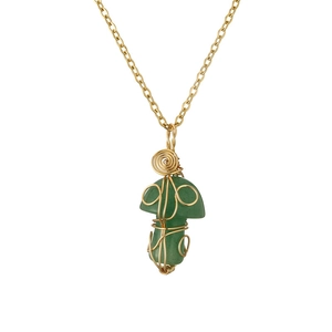 Handmade green crystal mushroom pendant necklace with gold wire wrap on white background