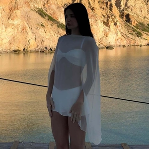 Macro shot of breathable white sheer chiffon cover-up fabric and lightweight texture