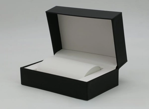 Detailed view of black textured PU leather watch box with white soft inner velvet pillow