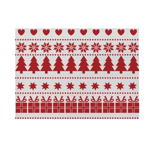 Detail of Christmas cotton linen placemat with festive red snowflake and tree prints