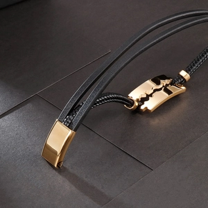 Braided black leather bracelet with golden stainless steel razor blade charm for men