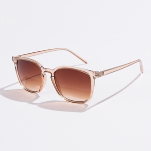 Close-up of translucent tawny square frames and gradient brown lenses of trendy sunglasses