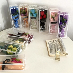 Detail of colorful soap rose bouquets in transparent PVC gift boxes for Valentine's Day gift