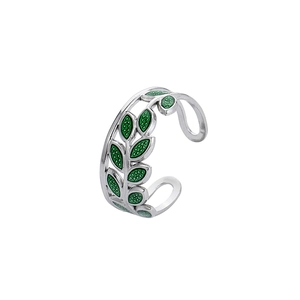 Macro detail of silver leaf ring with green enamel inlay and adjustable open band