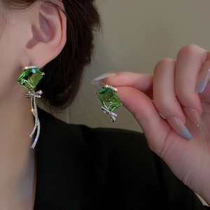 Asymmetric silver needle earrings with green gems and Marry Me engraving