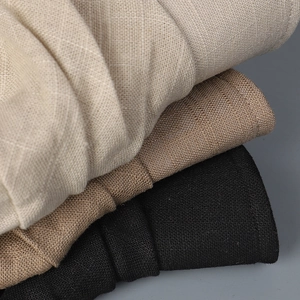 Detailed macro view showing the natural linen fabric texture in beige, brown and black