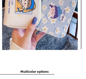 Detail of cute synthetic leather card holder with cartoon girl pattern and metal zipper