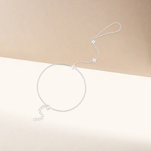Detailed view of silver clover hand harness with layered chains and adjustable lobster clasp