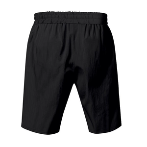 Rear view of black linen drawstring shorts featuring elastic waistband and texture details