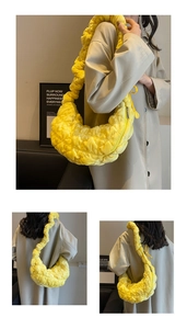 Detail of yellow cloud dumpling bag featuring quilted pleats and soft ruched shoulder strap